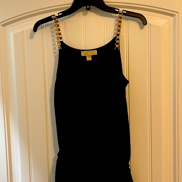 One piece straight leg jumpsuit can be dressed up or down. - Picture 1 of 3